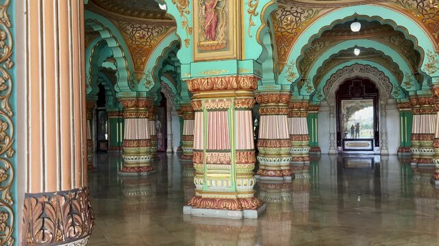 Ornately decorated pillars and arches inside Mysore Palace in Mysuru, Karnataka, India, showcasing the grandeur of Indo-Saracenic architecture and royal heritage