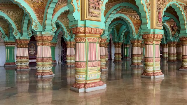 Ornately decorated pillars and arches inside Mysore Palace in Mysuru, Karnataka, India, showcasing the grandeur of Indo-Saracenic architecture and royal heritage