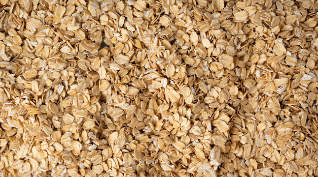 Oat flakes textured pattern, rolled oatmeal macro background