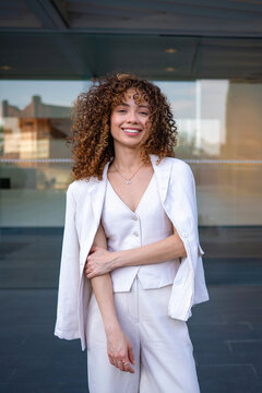 Smiling young woman wearing stylish business casual outfit