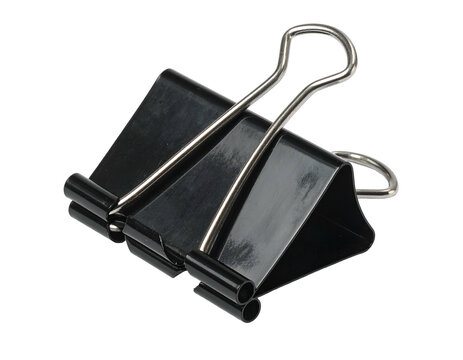 Black metal binder clip isolated on black background studio shot