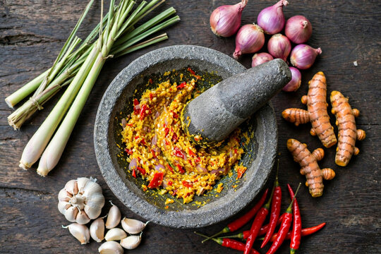 Indonesian spices in stone mortar cobek for traditional soup