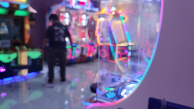 Blurred Defocused Arcade Game Center with Colorful Neon Lights and Claw Machines Background, Bokeh Entertainment Backdrop