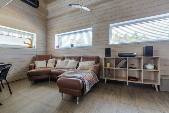 Modern Country House Living Room Interior with Brown Leather Sofa