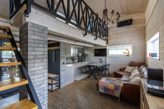 Open Plan Interior View of Modern Country House with Mezzanine and Living Spaces