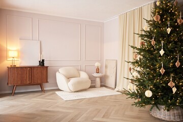 Fototapeta premium A beautifully decorated Christmas tree stands in a bright modern living room with Scandinavian-inspired furniture and warm ambient lighting.Neutral tones,elegant decor create a stylish home atmosphere