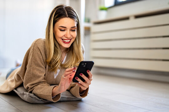 Young woman smiling with smartphone influencer life, social media engagement, remote freelancing