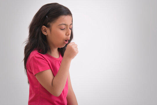 Young girl suffering from cold and couching severely. (Children) 