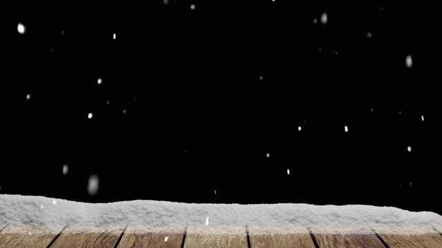 Snow falls on a wooden floor with a pile of snow