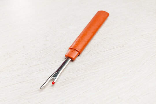 A sewing tool thread handler to open wrong stitches