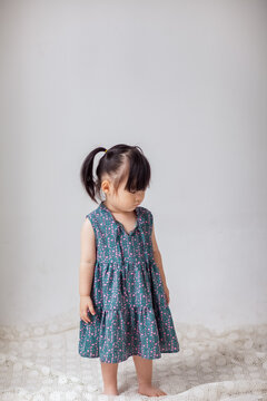 Cute Asian little girl playing indoors
