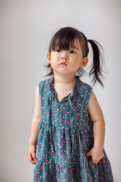 Cute Asian little girl playing indoors
