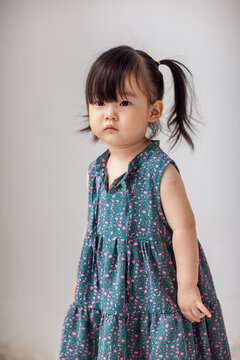 Cute Asian little girl playing indoors