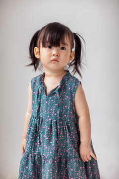 Cute Asian little girl playing indoors