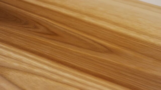 Warm wooden surface with diagonal blur over honey brown grain, knots, and soft plank pattern for rustic background design, with wood, grain, surface, texture detail