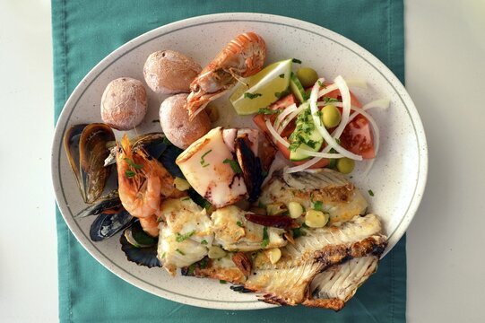Typical fish dish with shrimps, mussels, whiting, octopus, boiled potatoes, Lanzarote, Canary Islands, Spain