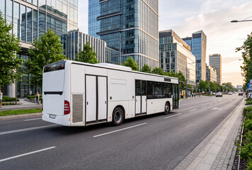 Fototapeta premium Modern city bus with blank full-side advertising space driving through a contemporary business district. Perfect for transit advertising, vehicle branding, outdoor marketing and bus wrap mockup presen
