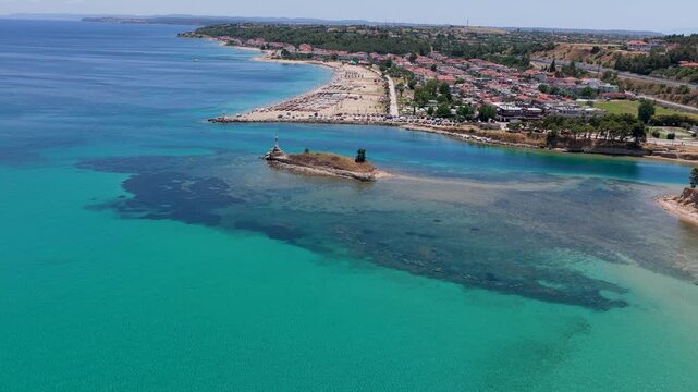Nea Poteidaia Lighthouse Islet Beside Turquoise Coastal Waters