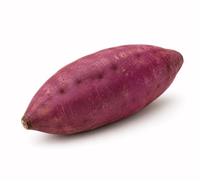 A single fresh purple sweet potato on a neutral background
