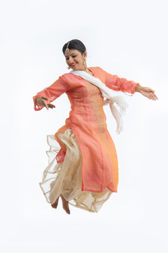 Kathak dancer jumping in the air. 