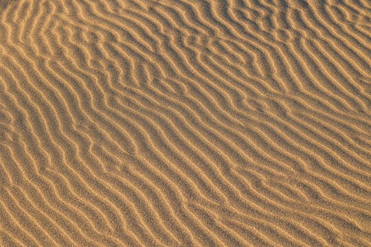 Aerial view of sand dunes with intricate ripple patterns formed by wind in Selfoss, Sveitarfelagid Arborg, Iceland.