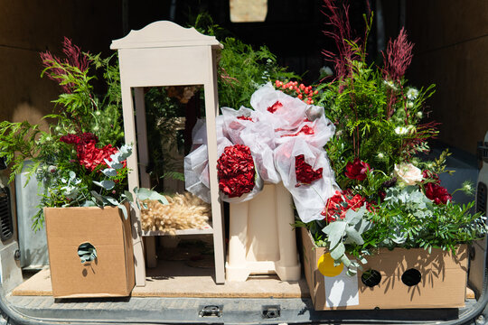 Flower delivery van loaded with fresh bouquets and greenery