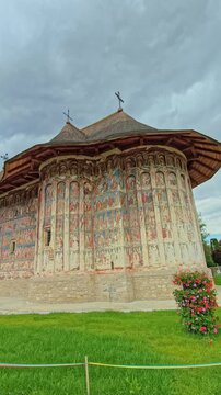 Historic Humor Monastery with unique exterior frescoes, an iconic UNESCO World Heritage site surrounded by nature in Bucovina, Romania.