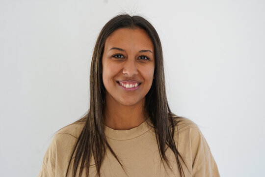 Happy young latin woman smiling on camera - Portrait of cheerful multiracial girl - Beauty, imperfection and lifestyle concept