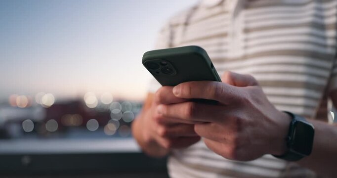 Phone, hands and person outdoor at night for online communication, text and update with bokeh. Mobile, typing and man in city for internet post, notification and social media message with space