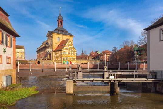 View of the historic City Hall, traditional buildings and the Regnitz River in the center of Bamberg, Bavaria, Germany.