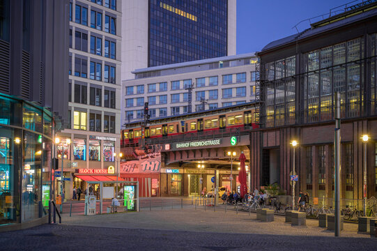 Berlin, Germany &ndash; May 13, 2024: Bahnhof Friedrichstrasse at Blue Hour with Passing S-Bahn Train