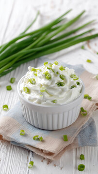 Sour Cream with Green Onion in White Bowl Isolated on White Background