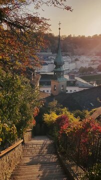 Salzburg historic town with Kapuzinerstiege stairs at sunset, Salzburg Land, Austria