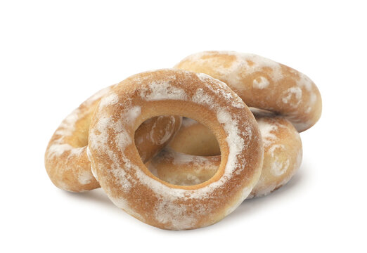 Pile of dry bagels close-up on a white background. Isolated
