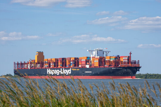 Stade, Germany &ndash; July 14, 2026: Container ship GDANSK EXPRESS, operated by German shipping company Hapag-Lloyd, sailing towards Hamburg on Elbe river.