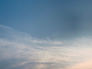 Fototapeta premium Natural blue sky with elegant wispy clouds above Jakarta, Indonesia. A clean atmospheric scene offering generous copy space for weather, environmental, travel, wellness, and creative background projec