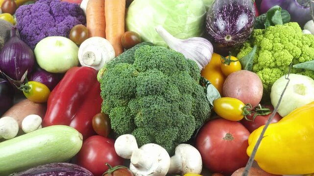 Fresh Organic Vegetables Pan Camera View Close Up On Dark Background.