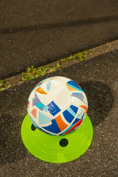 Official match ball sitting on display stand on sideline, football sports competition and game kickoff concept