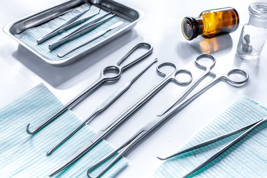 Rejuvenation by plastic surgery: medical instruments on white table backgrond