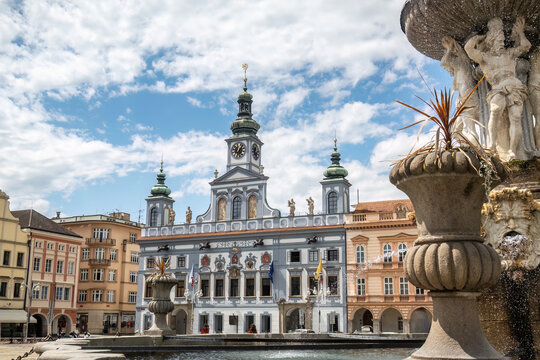 View of the historic Town Hall and Samson Fountain on the main square of Česk&eacute; Budějovice under a summer sky.