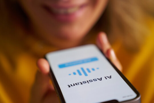 Close-up of smartphone displaying AI voice assistant interface