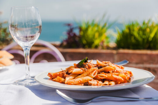 Italy, Atrani, plate of Penne Rigate with tomato sauce and tuna