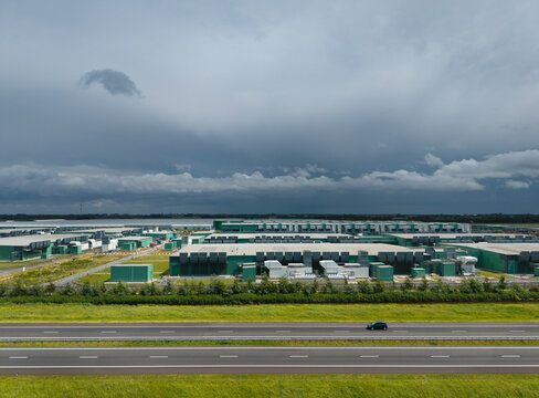 Large data center in Middenmeer under dark rainclouds