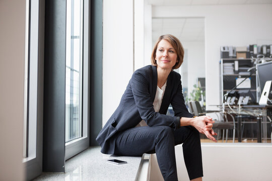 Businesswoman sitting at the window