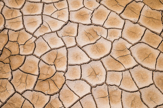 Parched cracked earth forms a geometric pattern in Hverir Iceland