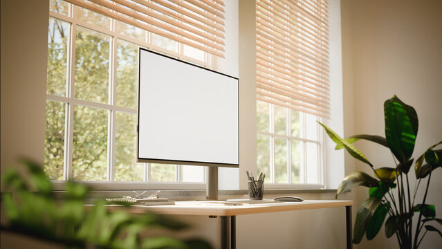 Modern Workspace with Computer Screen Mockup and Sunlit Windows