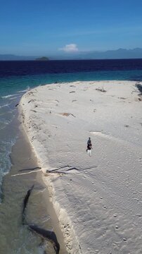 Aerial View of Person Running on a Remote Tropical Sandbar