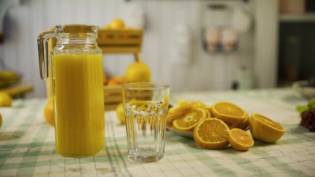 Cinematic, slow tracking shot of delicious orange display in kitchen