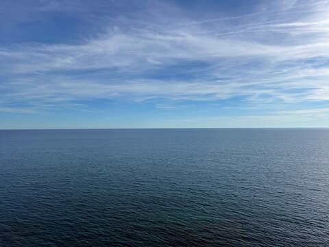 Open calm sea and cloudy sky