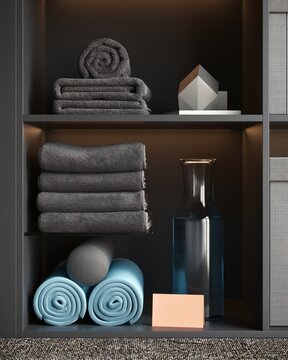 Recovery station shelf with towels, foam roller, and water carafe in studio